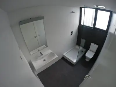 a white bathroom with a sink and a toilet at Room018BCN in Barcelona