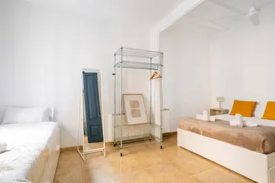 two blue doors in a room with a mirror at The Collection Barcelona - Private terrace Attico 3BD in Gran de Gracia in Barcelona
