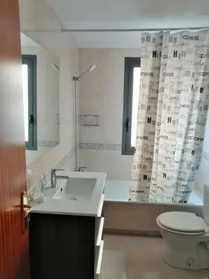 a bathroom with a sink and a shower with a toilet at Splash in Barcelona