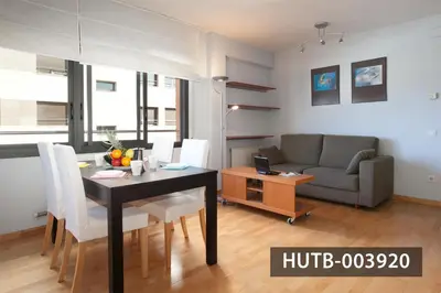 a living room with a table and a couch at Splash in Barcelona