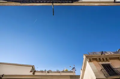 a view of the sky from between two buildings at Hostal Sol y K in Barcelona