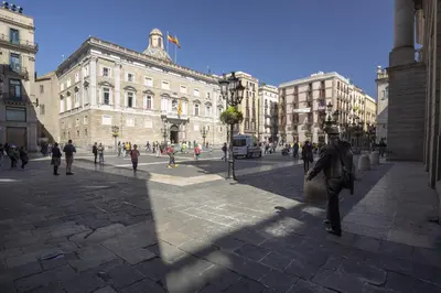a group of people walking around a city street at Hostal Sol y K in Barcelona