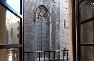 a window of a brick building with a large window at Best House Best Place in Barcelona