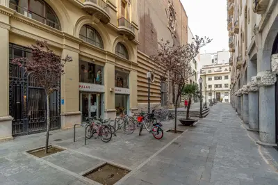 a group of bikes parked in front of a building at Canela Homes BARCELONA JARDINETS in Barcelona