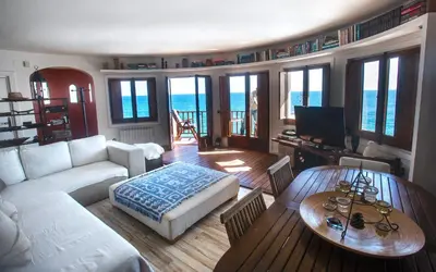 a living room with a couch and a table at Tot Gaviota in Sitges