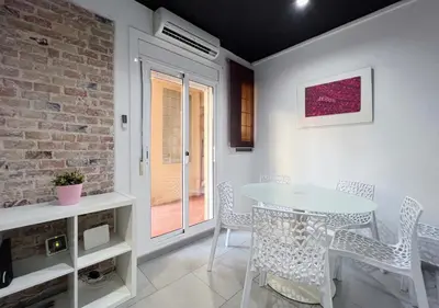a dining room with a table and chairs at Stay U-nique Apartment Comte Urgell II in Barcelona