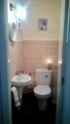 a bathroom with a toilet and a sink at Apartament modern al carrer Blai, Poble Sec in Barcelona