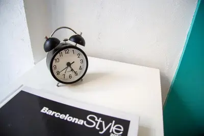an alarm clock sitting on top of a shelf at Villa Sagrada in Barcelona