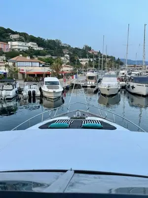 a boat is docked in a harbor with boats at MotorYacht 21 avec équipage in Barcelona