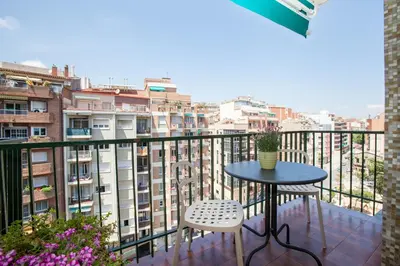 a balcony with a table and two chairs at Rosselló Apartment in Barcelona