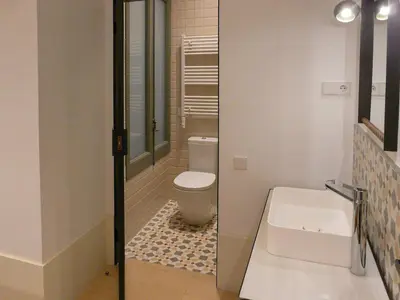 a bathroom with a toilet and a sink at Casa Mathilda in Barcelona