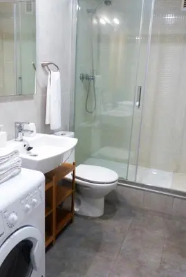 a bathroom with a toilet and a shower and a sink at Sitges Center & Beach with Sea View in Sitges