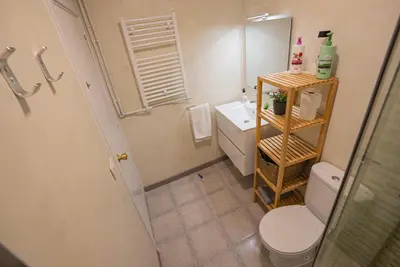a bathroom with a toilet and a sink and a mirror at Flat Top Manager in Barcelona