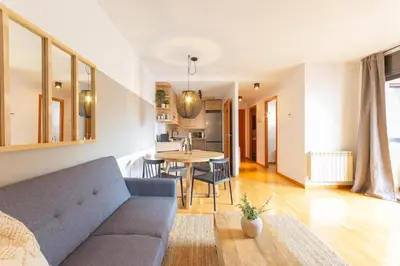 a living room with a couch and a table at Elegante dúplex en Terrassa, Barcelona in Terrassa