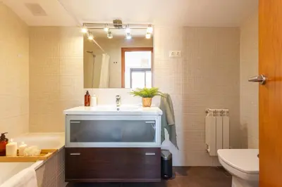 a bathroom with a large tv on a sink at Elegante dúplex en Terrassa, Barcelona in Terrassa