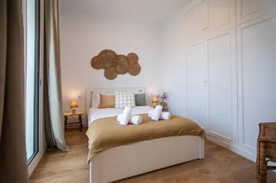 a bedroom with a bed with two teddy bears on it at 52PAR1012 - Magnific 3BR Apartment in Paralel in Barcelona