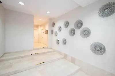 a room with grey plates on the wall at Port V Apart centrico con estilo 21 in Barcelona