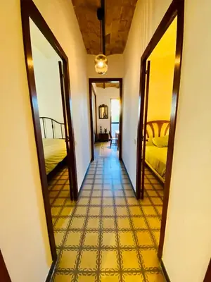 a hallway with two beds and two mirrors at Piso en Poblenou, Playa a 5 min in Barcelona