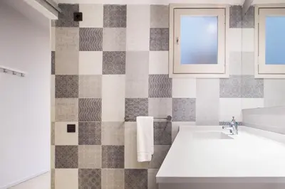 a bathroom with a sink and a tub at Barcelona InLoft in Barcelona
