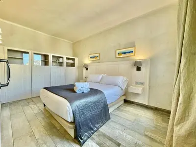a bedroom with a bed in a room at BarcelonaForRent Market Penthouse in Barcelona