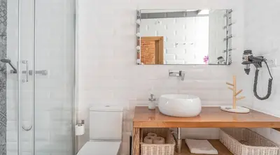 a bathroom with a sink and a shower with a mirror at Stay U-nique Apartment Tamarit in Barcelona