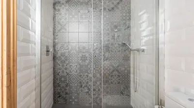 a shower with a glass door in a bathroom at Stay U-nique Apartment Tamarit in Barcelona