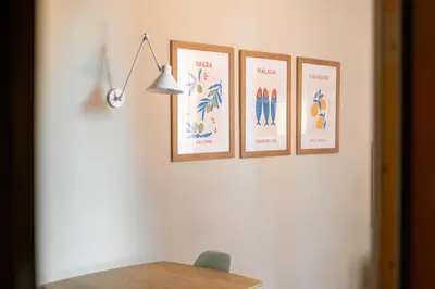 a group of four pictures hanging on a wall at Stay U-nique Apartments Torre d'En Damians II in Barcelona