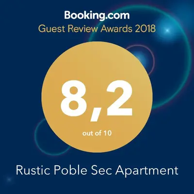 a yellow circle with the words guest review awards rusty pole seg apartment at Rustic Poble Sec Apartment in Barcelona