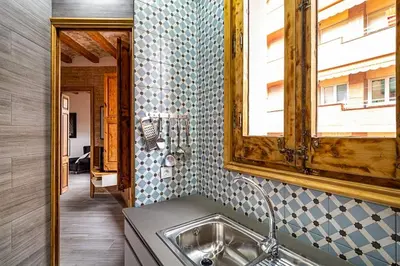 a bathroom with a sink and a mirror at Stay U-nique Apartment Ermengarda in Barcelona