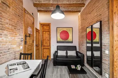 a living room with a couch and a chair at Stay U-nique Apartment Ermengarda in Barcelona
