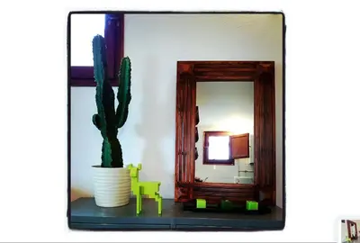 a room with a mirror and a cactus on a table at Barcelona Old Town attic near Catalunya square in Barcelona