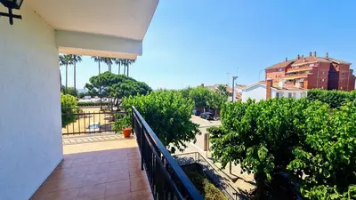a balcony of a building with trees and a street at Apartamento Cabrera Burriac in Cabrera de Mar
