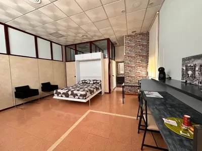 a bedroom with a bed and a table in a room at stop & go in Arbós