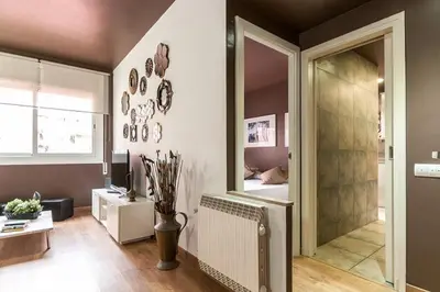 a room with a walk in shower and a mirror at Stay U-nique Apartment Parallel in Barcelona