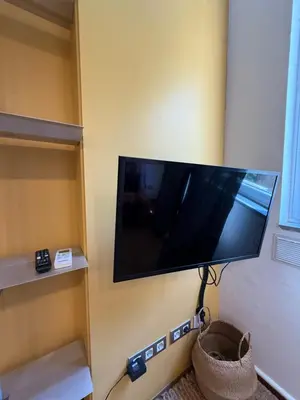 a flat screen tv hanging on a wall at Maravilloso piso en el corazón de Barcelona in Barcelona