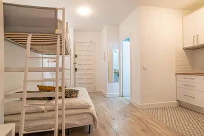 a bedroom with a bunk bed in a room at Welcomy Sant Andreu in Barcelona