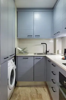 a kitchen with a washing machine and a sink at Cozy Apartment Les Corts in Barcelona