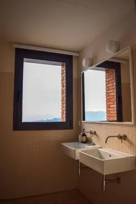 a bathroom with two sinks and a mirror at Circles House Coliving & Coworking in Barcelona