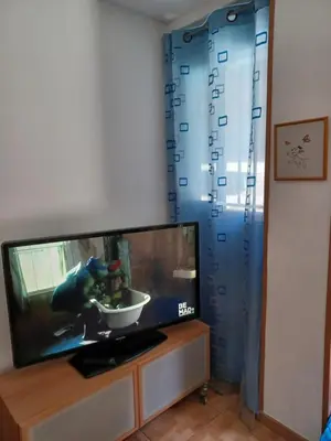 a tv screen with a video game on it at Casa Ferrer Barcelona in Hospitalet de Llobregat