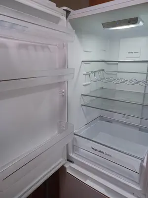 a white refrigerator with its door open and its at Casa Ferrer Barcelona in Hospitalet de Llobregat