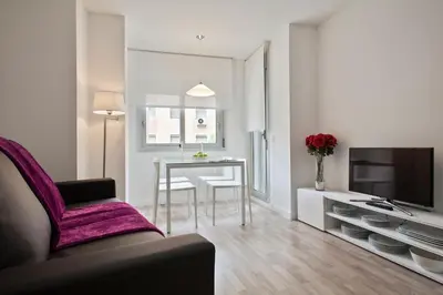 a living room with a couch and a table at Habitat Apartments Blanca in Barcelona