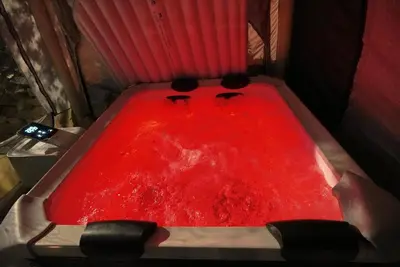 a red bath tub filled with red liquid at AAA View Private Terrace Outdoor Heated Hot Tub Family Fun in Badalona
