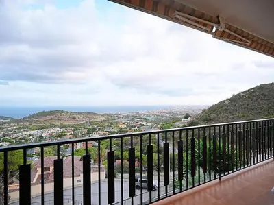 a balcony with a view of a city at A+View Private Terrace Private Pool Family Fun in Badalona