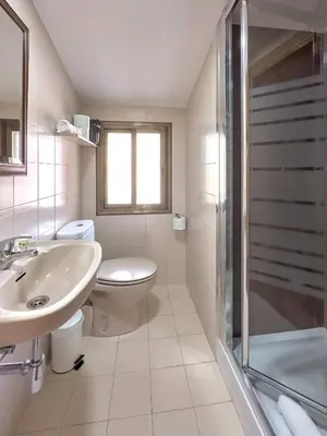 a bathroom with a toilet and a sink and a shower at Stay U-nique House Torre Damians in Barcelona