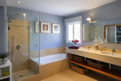 a bathroom with a tub and a sink and a shower at Villa Sitges Altavista Amazing View South oriented Calm Area AC Beach 2 minutes Drive and 18 minutes Walk in Sitges
