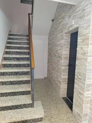 a staircase in a building with a brick wall at Apartament IXA-2 in Manresa
