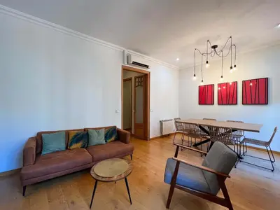 a living room with a couch and a table at Stay U-nique Apartments Mistral II in Barcelona