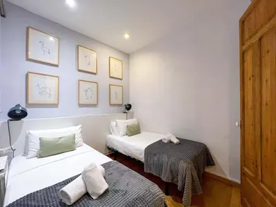 a room with two beds with towels on them at Stay U-nique Apartments Mistral II in Barcelona