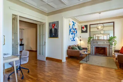 a living room with a couch and a fireplace at Canela Homes BARCELONA MODERNISTA in Barcelona