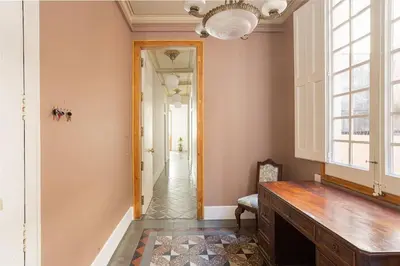 a hallway of a home with a table and a window at Canela Homes BARCELONA RAMBLA CAT in Barcelona